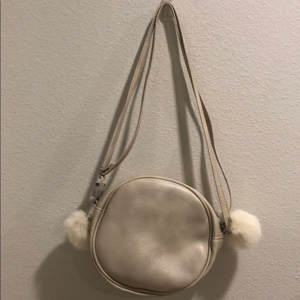 Champagne colored circle mini bag with poofs!